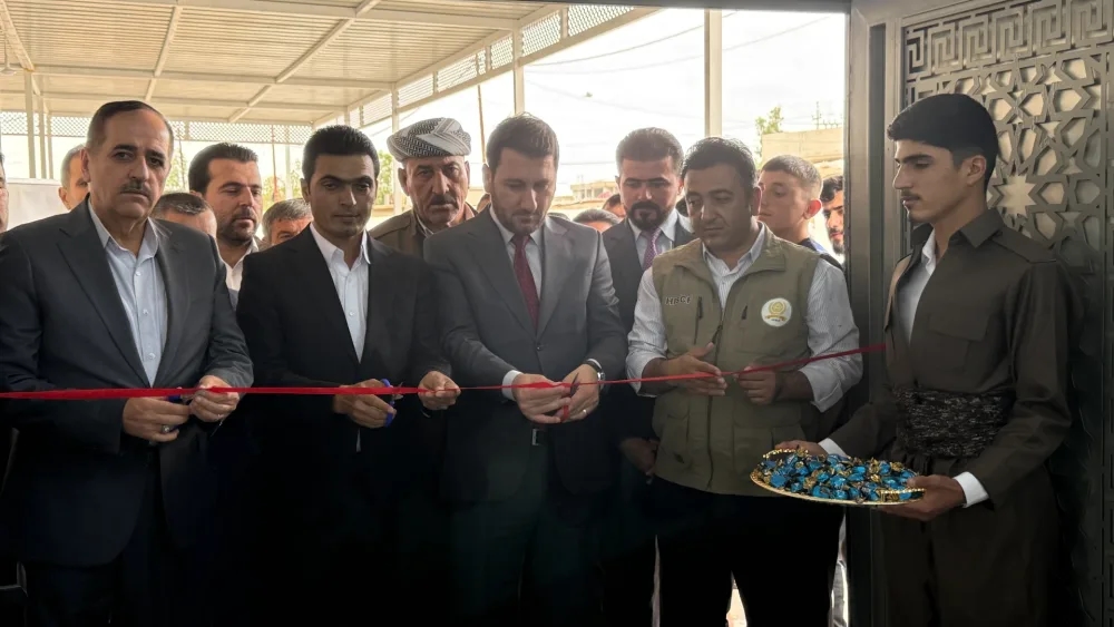 A ribbon-cutting at a foundation opening ceremony